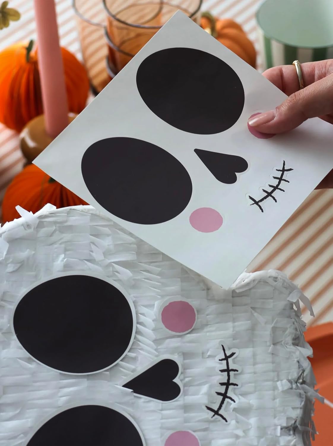 White Skull Shaped Pinata With Face Stickers