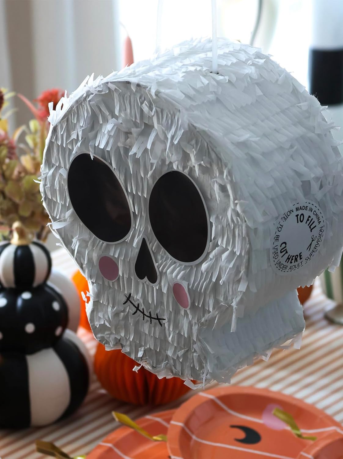 White Skull Shaped Pinata With Face Stickers